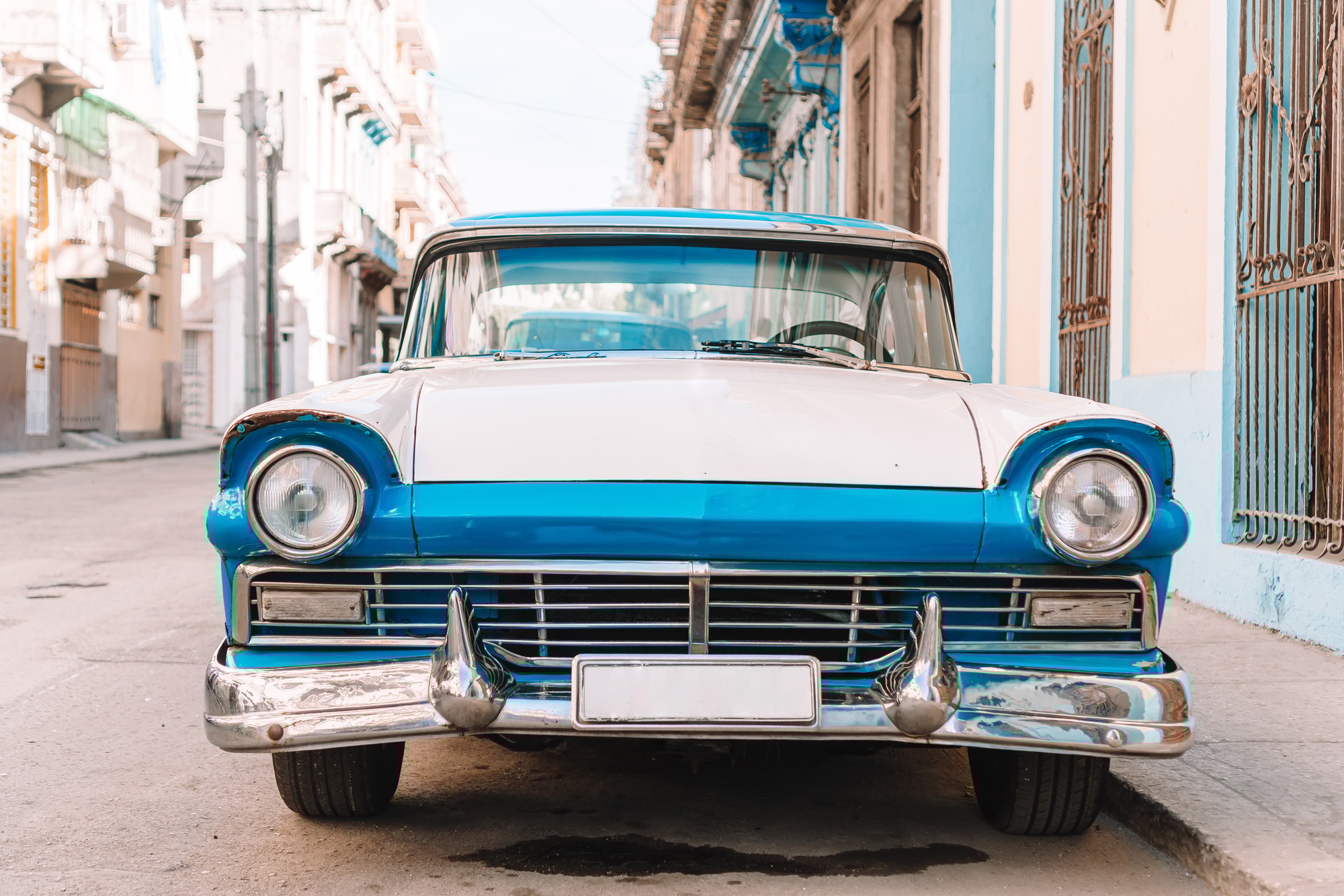 View of yellow classic vintage car in Old Havana, Cuba